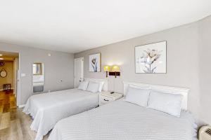 Ένα ή περισσότερα κρεβάτια σε δωμάτιο στο Sands Ocean Club 1630 +13 φωτογραφίες