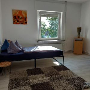 a room with a couch and a window at Ferienwohnung Stella Herford in Herford