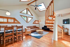 a living room with vaulted ceilings and skylights at Pet Friendly Flagstaff Studio Cabin with Patio in Flagstaff