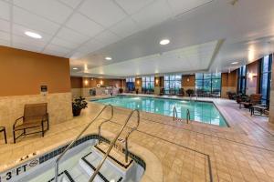 a large swimming pool in a hotel lobby at Hampton Inn & Suites Chadds Ford in Glen Mills