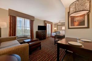 a hotel room with a couch and a living room at Homewood Suites by Hilton Denver Tech Center in Englewood