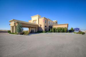 a large building with a parking lot in front of it at Hampton Inn & Suites Mountain Home in Mountain Home