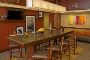 a large dining room with a large table and chairs at Hampton Inn & Suites Norfolk-Airport in Norfolk