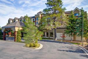 a building with a tree in the middle of a road at DoubleTree by Hilton Hotel Flagstaff in Flagstaff
