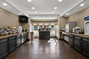 a large kitchen with a counter and some food at Comfort Inn Wytheville in Wytheville