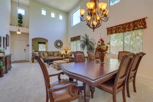 a dining room with a table and chairs at Spacious Maricopa Home Rental with Pool and Hot Tub! in Maricopa