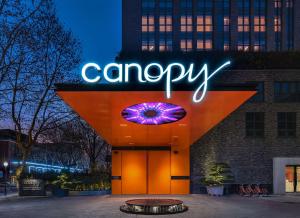 a canopy sign on the side of a building at Canopy by Hilton Hangzhou West Lake in Hangzhou