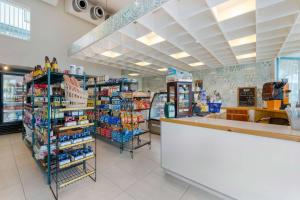a grocery store aisle with a counter in a store at Hilton Vacation Club Royal Palm St Maarten in Simpson Bay