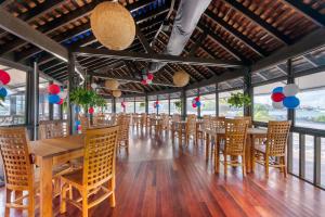 a dining room with wooden tables and chairs at Hilton Vacation Club Royal Palm St Maarten in Simpson Bay