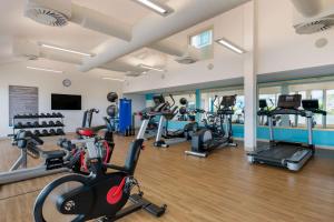 a gym with several treadmills and cardio machines at Hilton Vacation Club Royal Palm St Maarten in Simpson Bay