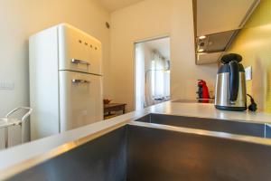 Η κουζίνα ή μικρή κουζίνα στο SkyAttic - 801 - CItyLife - 1 min Domodossola M5 +17 φωτογραφίες