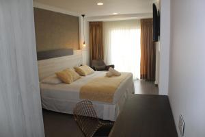 Postel nebo postele na pokoji v ubytování Cartagena Royal Hotel Boutique