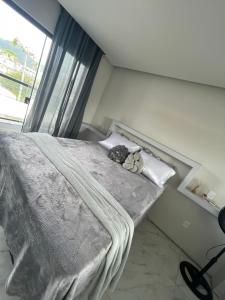 Postel nebo postele na pokoji v ubytování Loft proximo a diversas praias