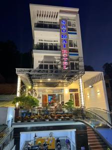 a building with a sign in front of it at Sao Mai Hotel & Apartment in Vung Tau