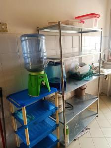 a kitchen shelf with a blender on it at Low Budget SingleBed Bedroom in Kuala Lumpur