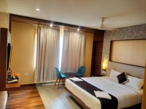 Postel nebo postele na pokoji v ubytování Wyt Hotels - Rameswaram