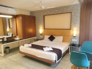 Postel nebo postele na pokoji v ubytování Wyt Hotels - Rameswaram