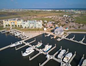 an aerial view of a marina with boats in the water at By Air & By Sea in Port Aransas