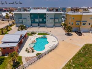 an aerial view of a resort with a swimming pool at By Air & By Sea in Port Aransas