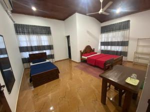 Voodi või voodid majutusasutuse East Gate 8-9 Batticaloa toas