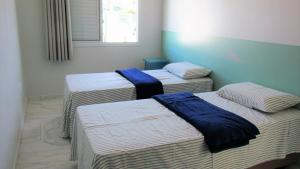 Säng eller sängar i ett rum på Recanto aconchegante no Campeche Apart 02 - 50m da praia -
