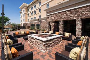 a patio with a fire pit in front of a building at Courtyard by Marriott Lubbock Downtown/University Area in Lubbock