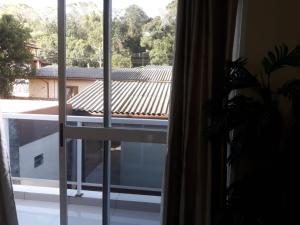 a window with a view of a roof at UNIJUI in Ijuí