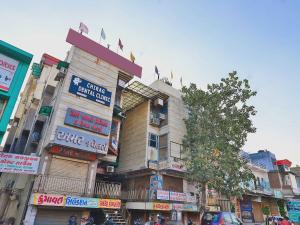 a building on a street in a city at Flagship Hotel Navjivan in Bātwa