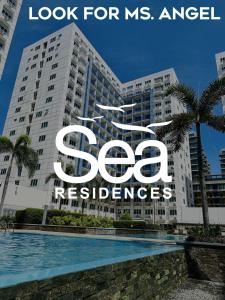 a large building with a sign that reads look for ms angel residences at Sea Residences - Property Val Alano 0995-448-8872 in Manila