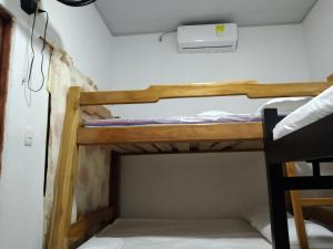 a bedroom with two bunk beds in a room at Cabañas MaryMar in Necoclí
