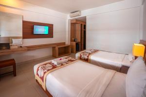Bali Summer Hotel by Amerta客房内的一张或多张床位