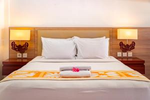 Bali Summer Hotel by Amerta客房内的一张或多张床位