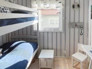 Postel nebo postele na pokoji v ubytování Holiday home SKÄRHAMN