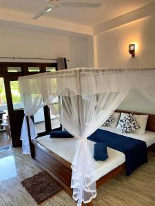 Postel nebo postele na pokoji v ubytování Shan Star Weligama