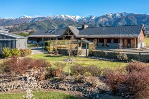 an image of a house with mountains in the background at Hanmer High Country Views in Hanmer Springs