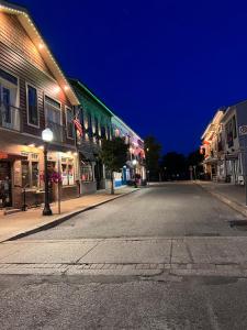 an empty street in a town at night at Cottage in Crystal Beach in Fort Erie +6 photos