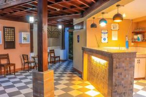 a restaurant with a fireplace in the middle of a room at Ananda Resort in Panglao Island