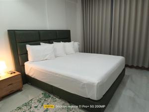 Un pat sau paturi într-o cameră la Hotel Sand View