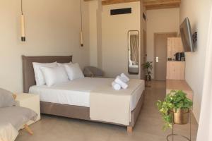 Postel nebo postele na pokoji v ubytování Living Stone Condo Hotel