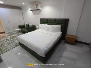 Un pat sau paturi într-o cameră la Hotel Sand View