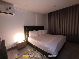 Un pat sau paturi într-o cameră la Hotel Sand View