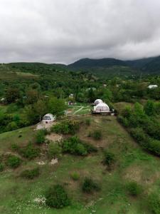 an aerial view of a field with domes at Glamping Dream Domes Ismayilli in İsmayıllı