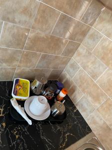 a counter top with food on it in a bathroom at Zoe heights villas in Kalungu