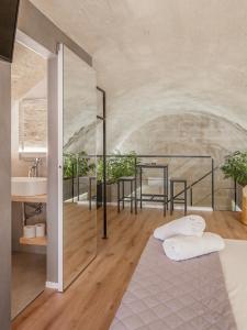Postel nebo postele na pokoji v ubytování Hydria Rooms