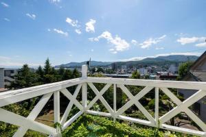 a view of the city from the balcony of a house at SHIONE in Otaru