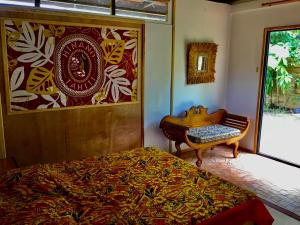 Postel nebo postele na pokoji v ubytování Faré Anaiti Moorea