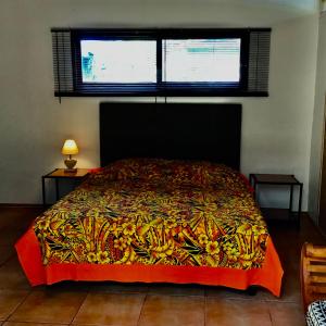 Postel nebo postele na pokoji v ubytování Faré Anaiti Moorea