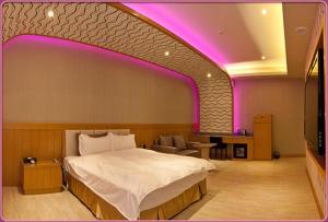 Postel nebo postele na pokoji v ubytování Wei Feng Hotel - Kaohsiung