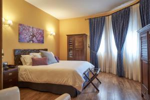 Posteľ alebo postele v izbe v ubytovaní Casona De Torres