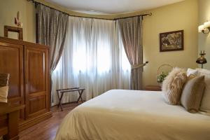 Posteľ alebo postele v izbe v ubytovaní Casona De Torres